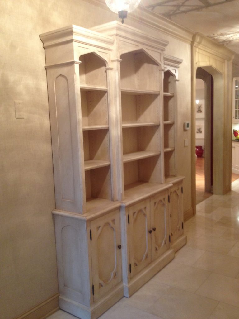This Bookcase wall unit in Wellesley has Gothic styling and a lightly distressed paint finish. 
